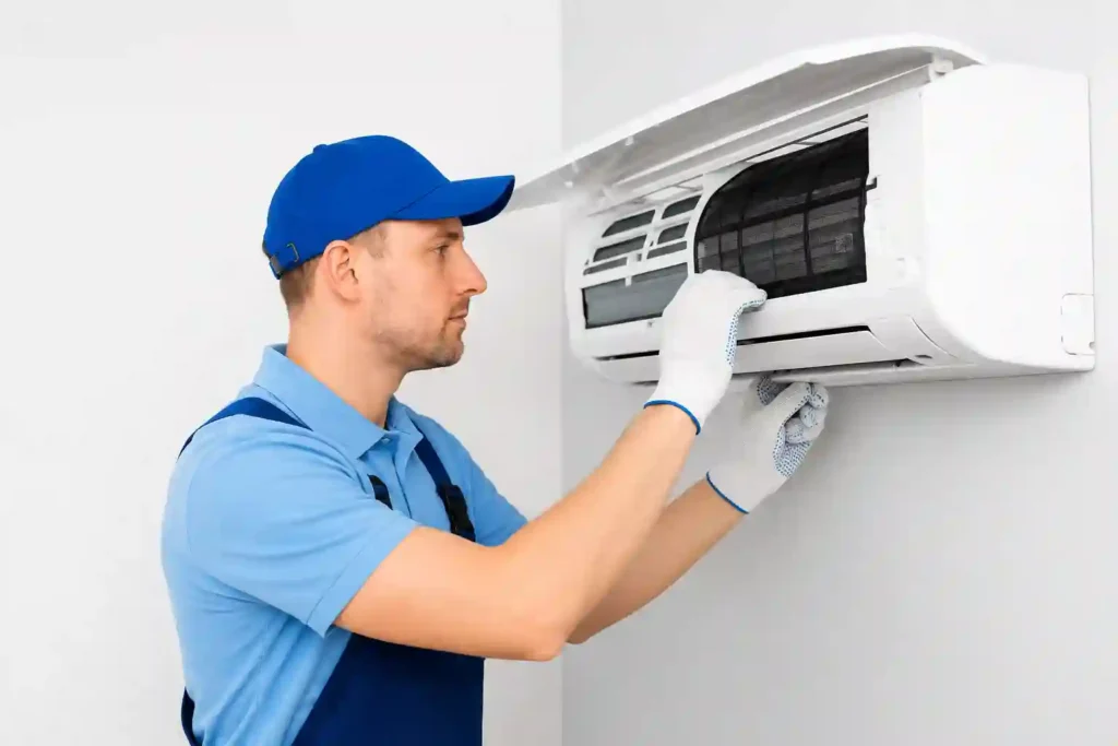 Technician performing Air Conditioning Installation in Saudi Arabia.